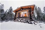 Log cabin in Lapland by the river